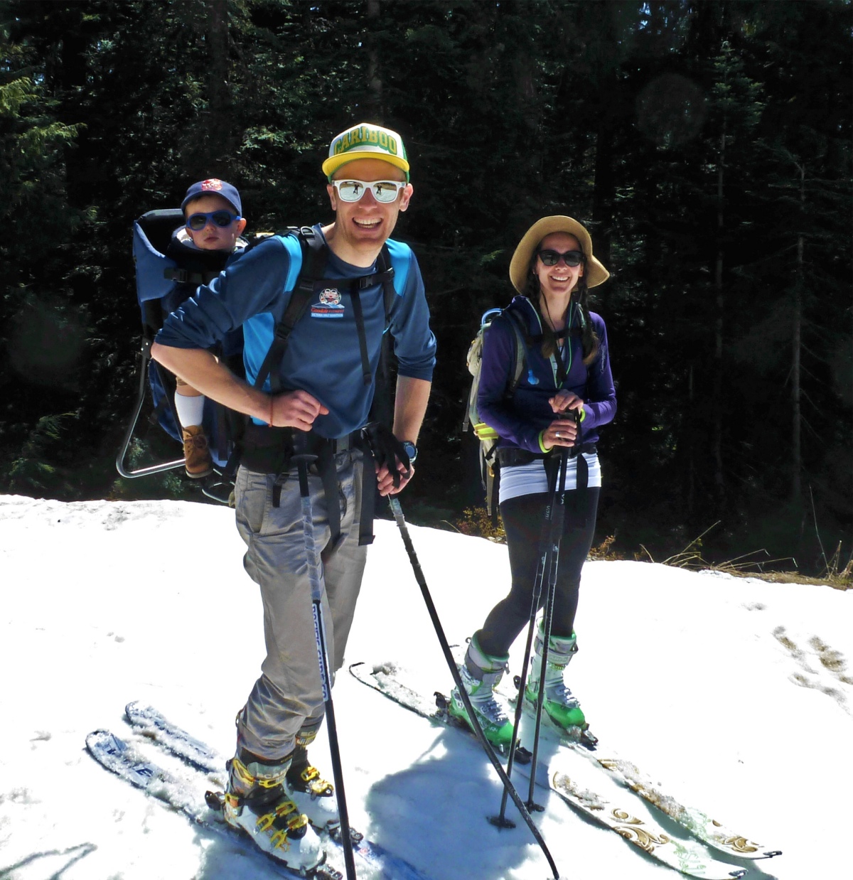 A family, including a baby in a backpack, skiing the spring snow on Mt. Strachan, May 1, 2016